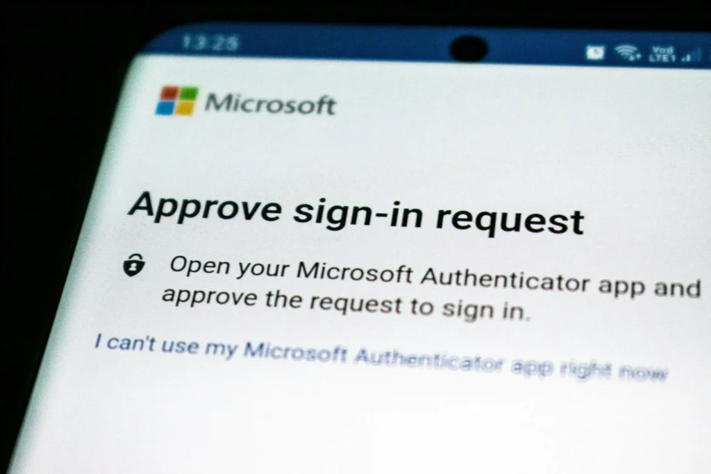 Close-up of a smartphone displaying a Microsoft sign-in approval request that asks the user to approve authentication through the Microsoft Authenticator app.