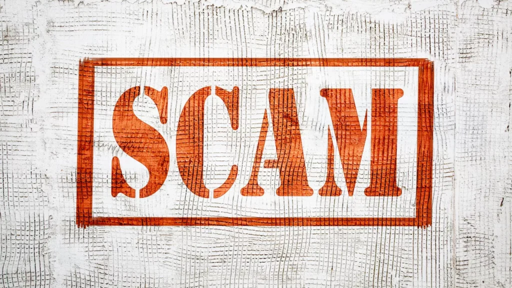 Image showing the word "SCAM" in bold, orange letters