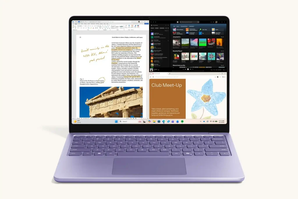 Microsoft Surface Laptop 8th Edition in lavender with a touchscreen displaying multiple apps and a compact keyboard