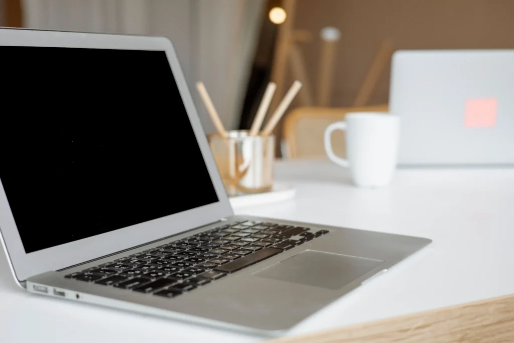 Laptop with a completely black display, illustrating a common black screen scenario that can occur during startup or while using a computer.